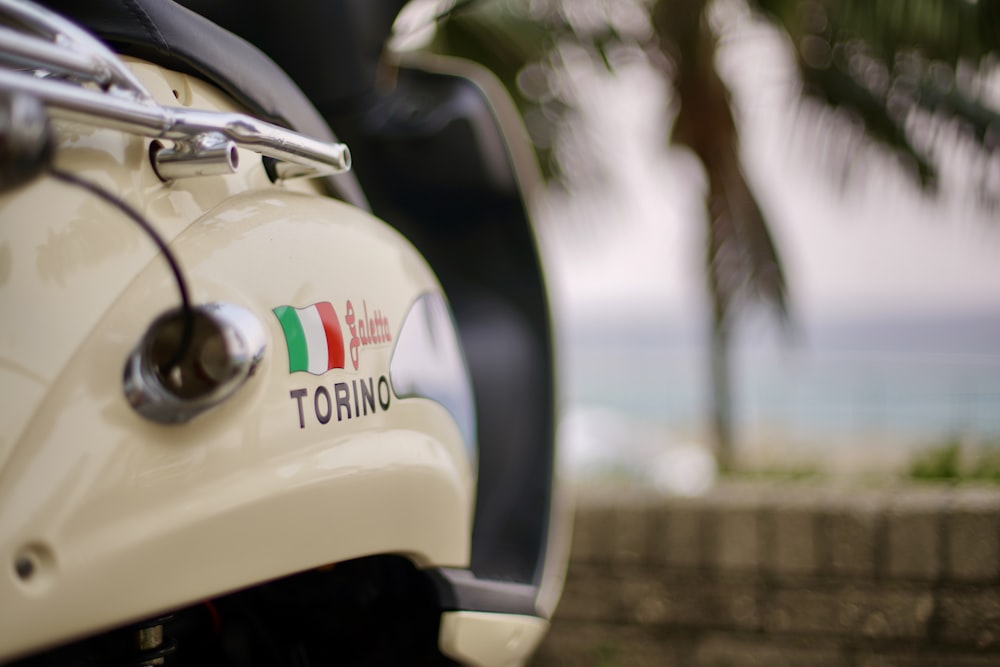 selective focus photography of parked vintage white car during daytime