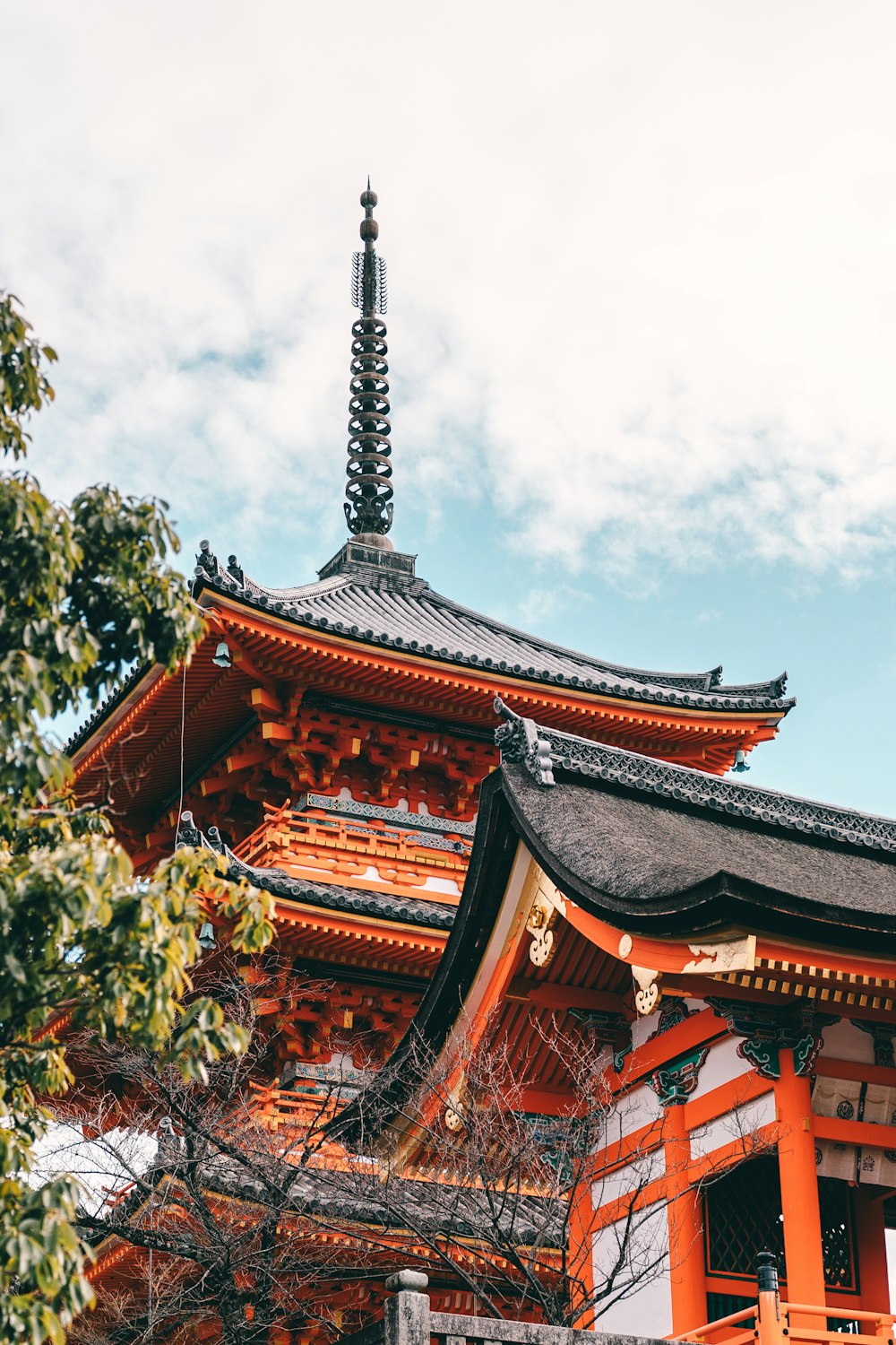 brown and black pagoda temple near trees