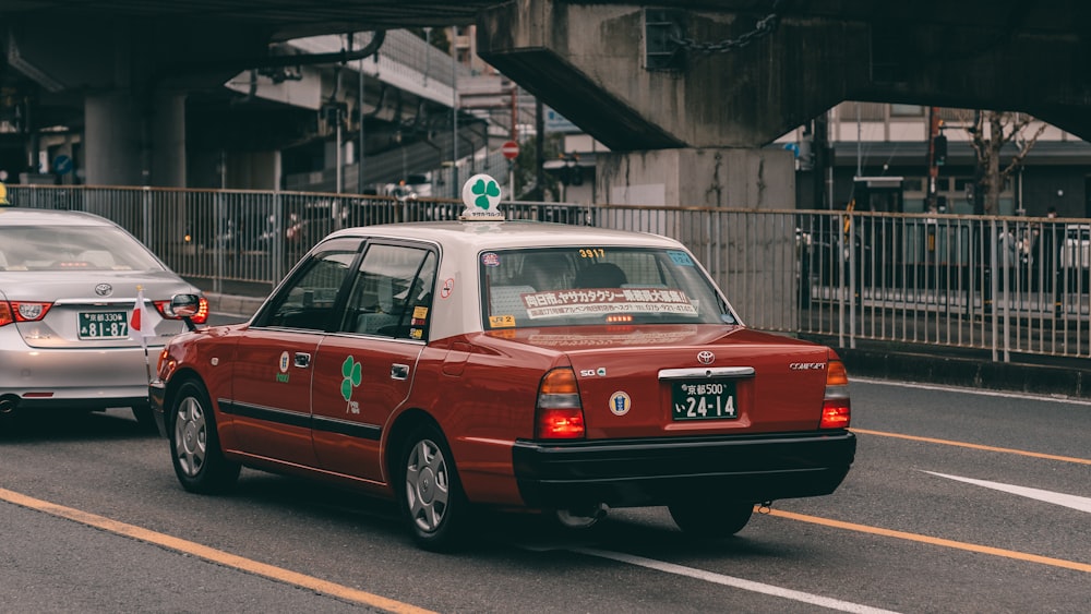 brown taxi cab near bridge