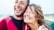 Close-up of smiling faces from different ethnic backgrounds showing genuine happiness together.