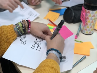 woman drawing houses