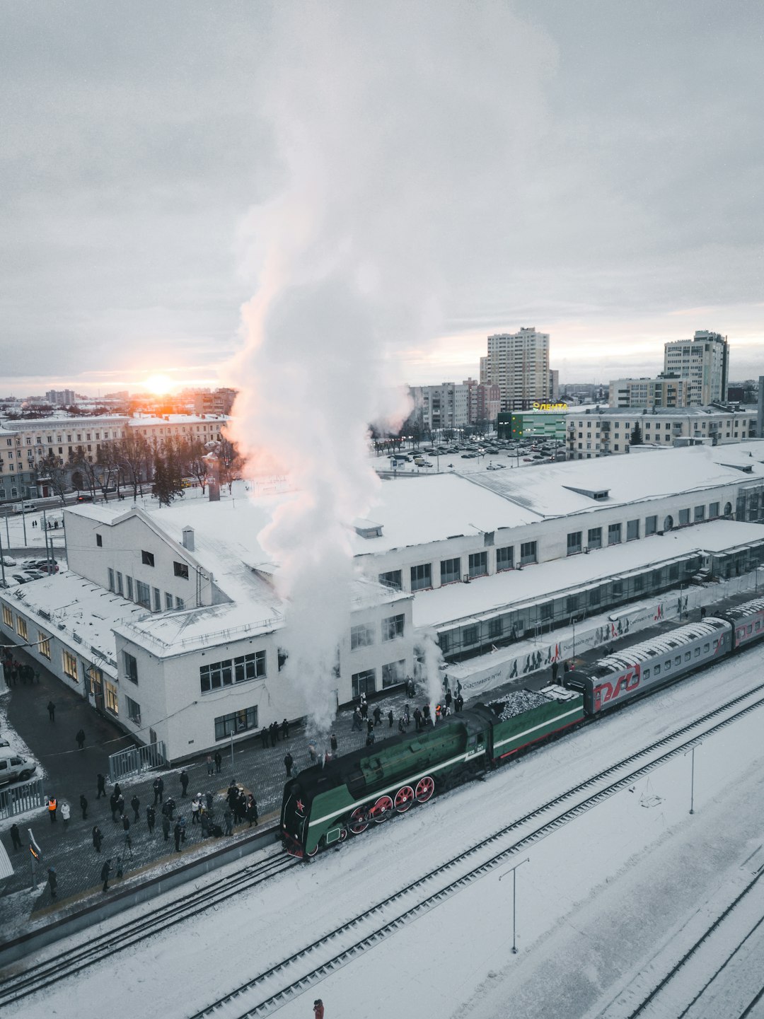 people standing beside train