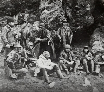 A group of men wearing warm winter coats outdoors.