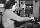 grayscale photo of woman using headphones