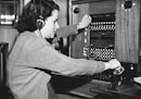 grayscale photo of woman using headphones