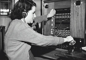grayscale photo of woman using headphones