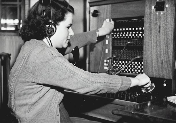 grayscale photo of woman using headphones