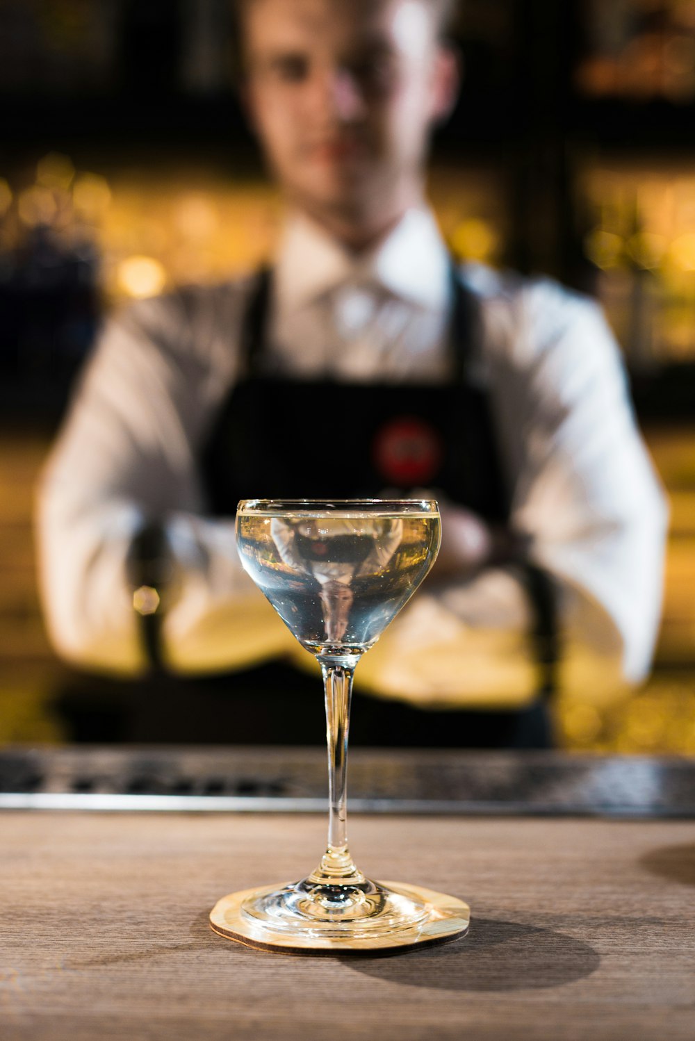 shallow focus photo of clear footed wine glass