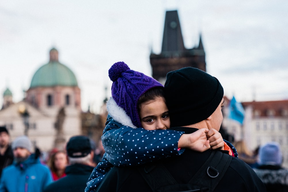 man carrying girl