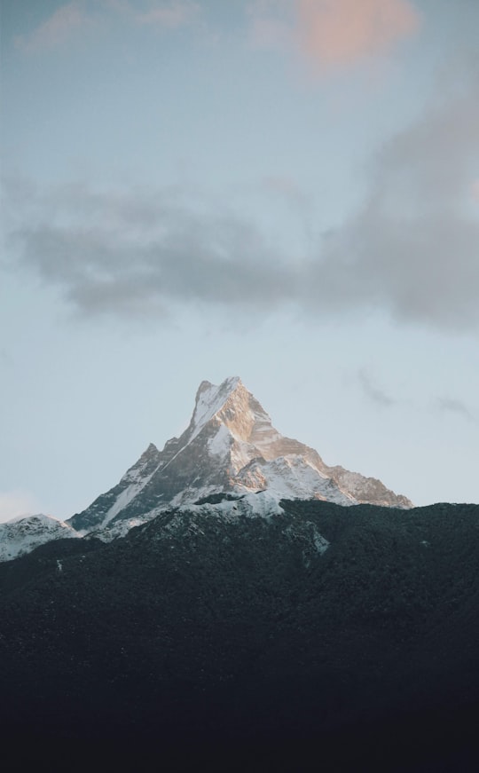 snow capped mountain under gray sky in Annapurna Nepal