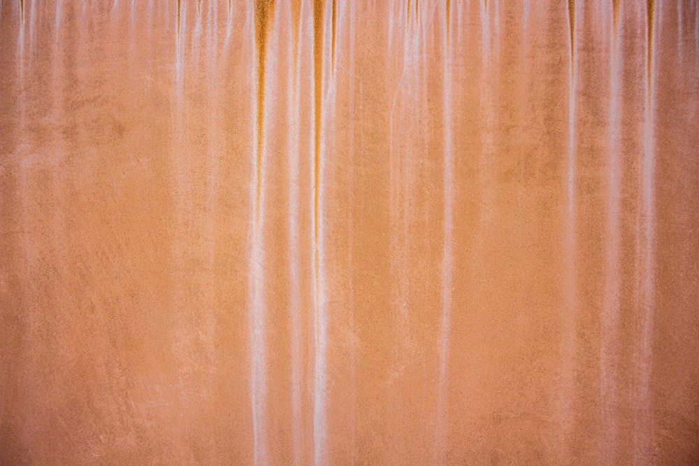 an orange curtain with a white background