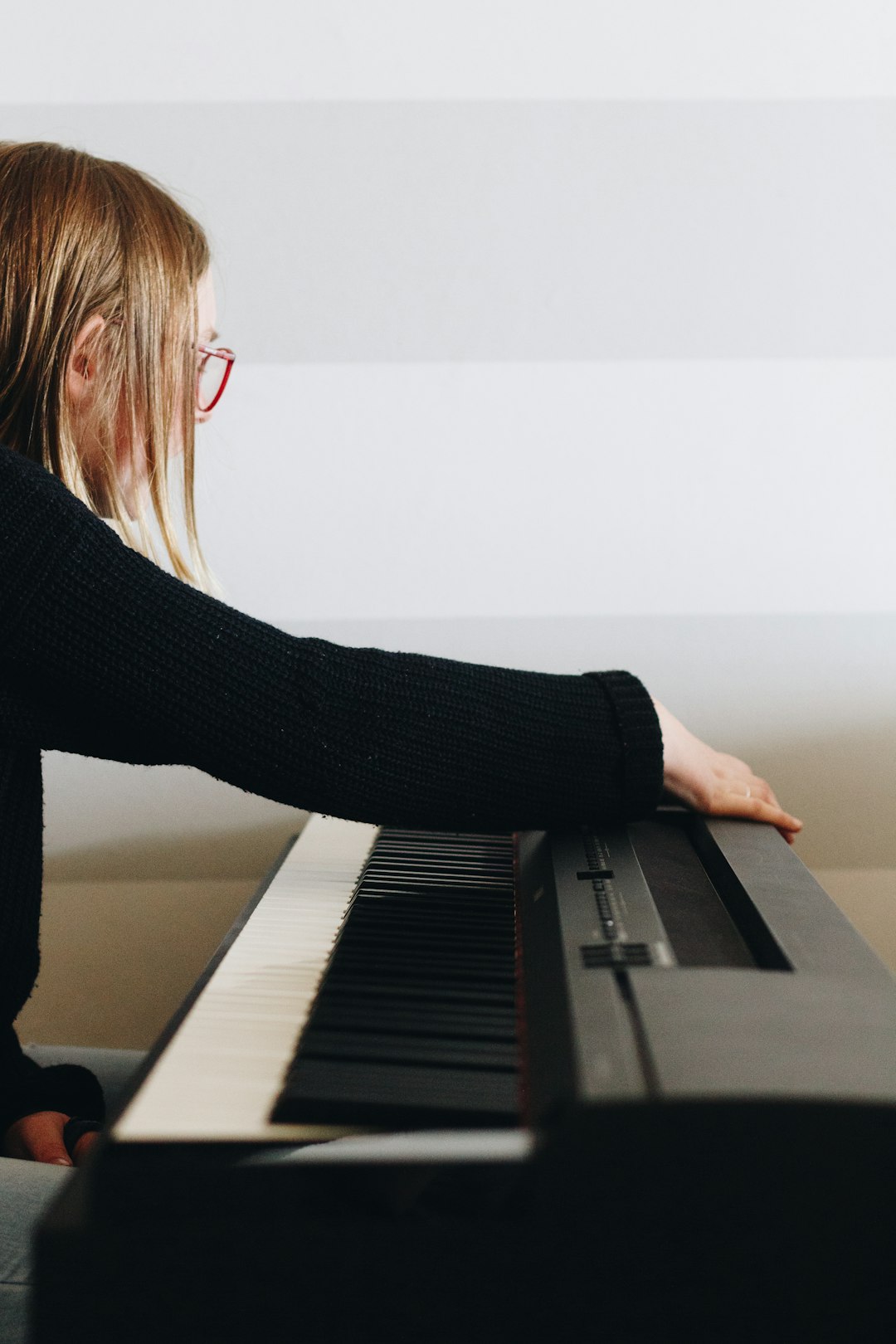 woman playing electronic keyboard