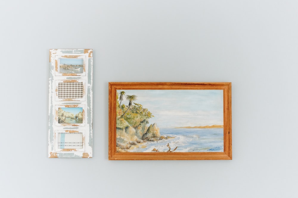 brown framed painting of beach