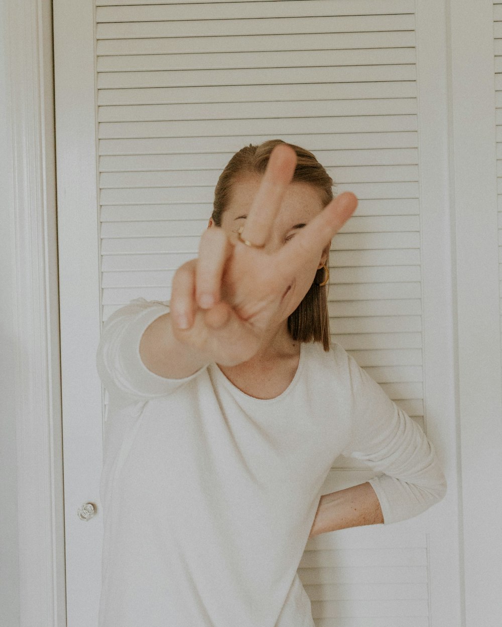 woman standing beside wall