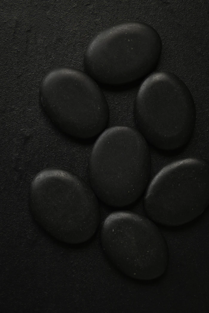 Smooth black massage stones