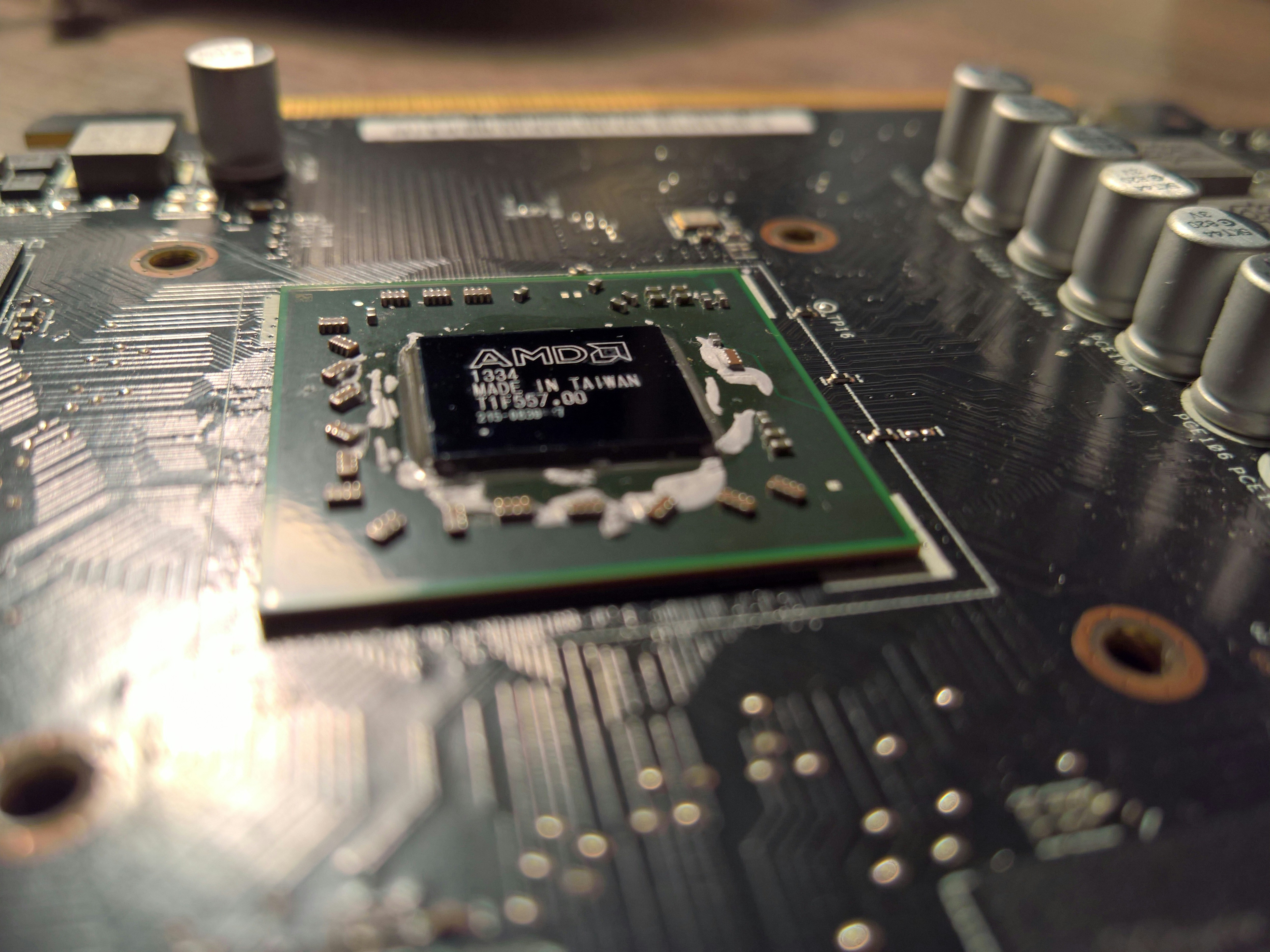 CPU processor chip on dark surface with circuit board texture, low-key industrial lighting