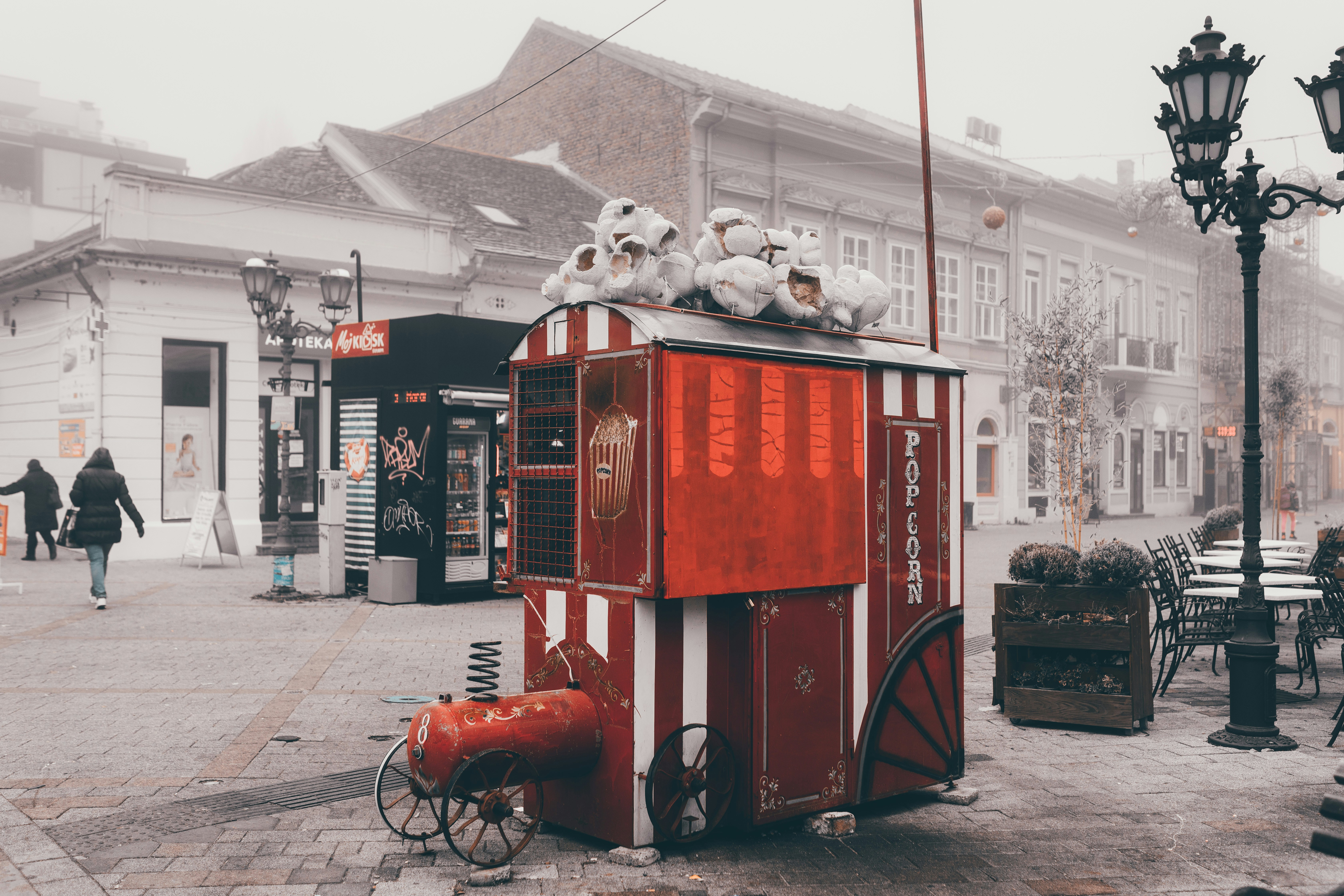 Popcorn Booth Near Benches And Lampposts During Day