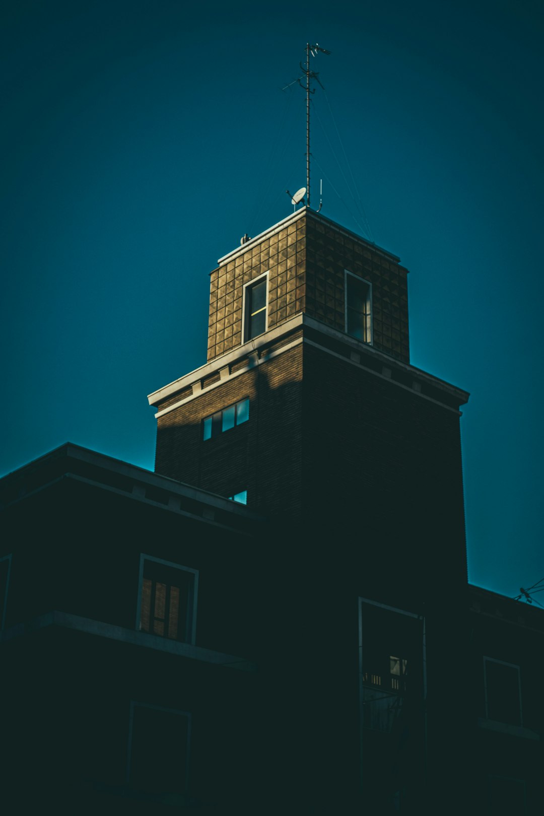 brown concrete structure with tower