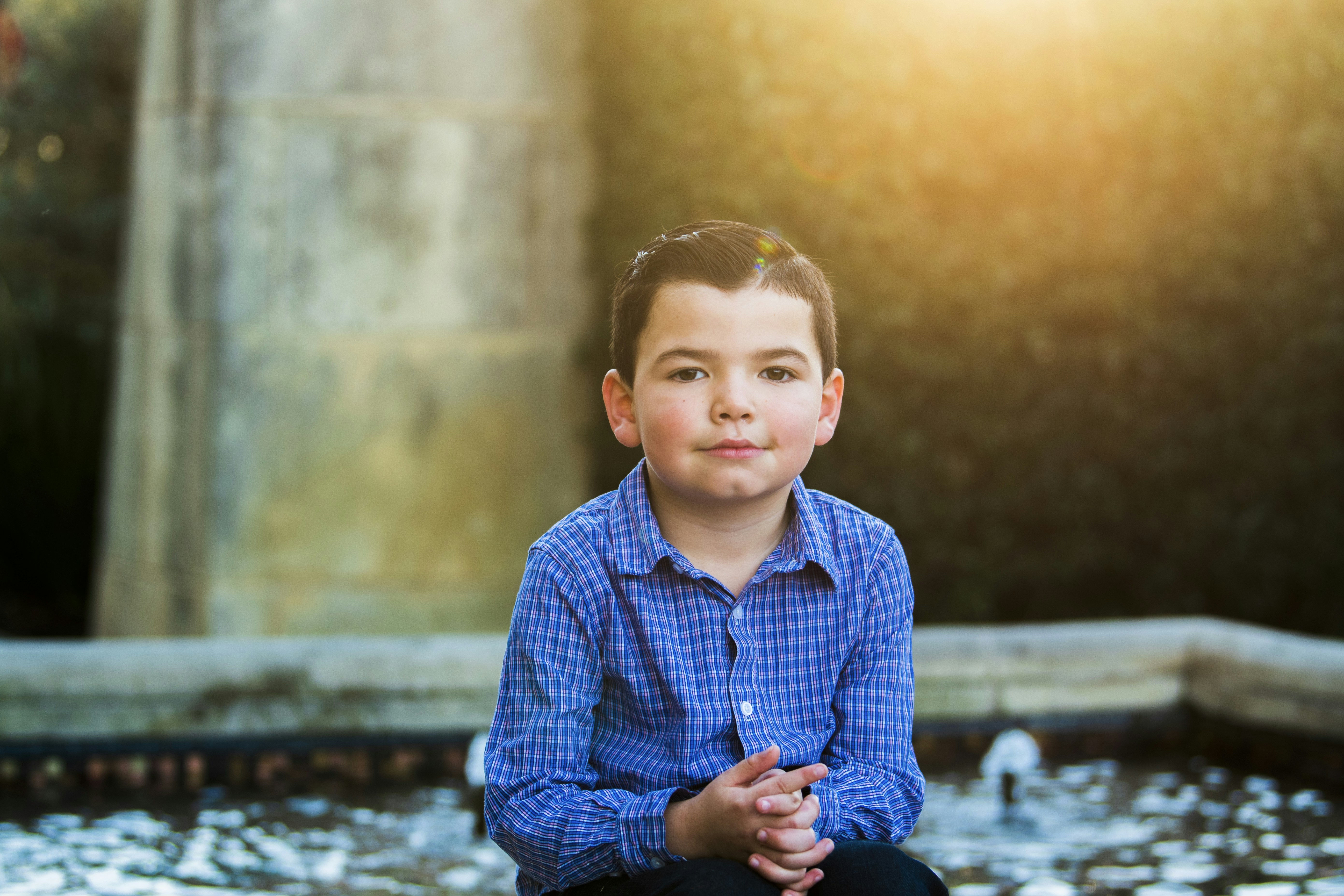 boy wearing blue dress shirt