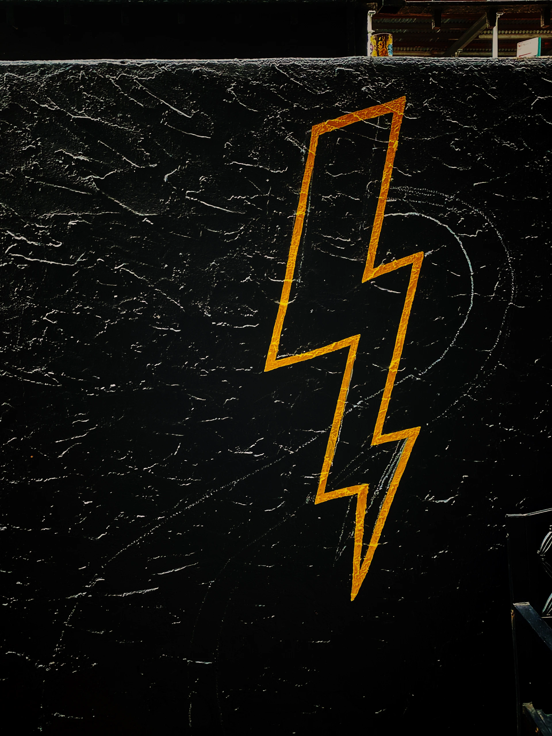 a picture of a lightning bolt painted on the side of a building