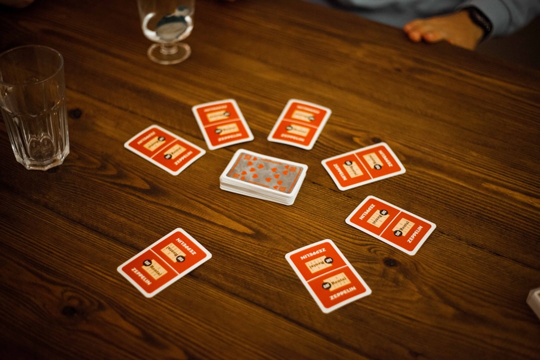 red and grey playing cards on table