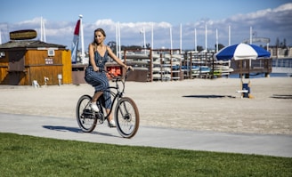woman riding bike neae beach