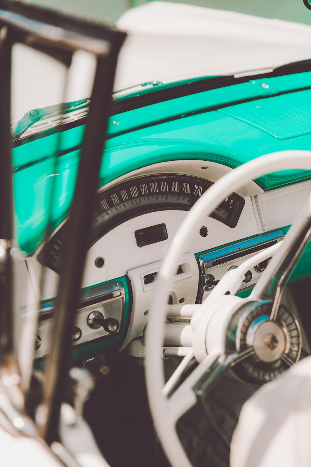 a close up of a steering wheel and dashboard of a car