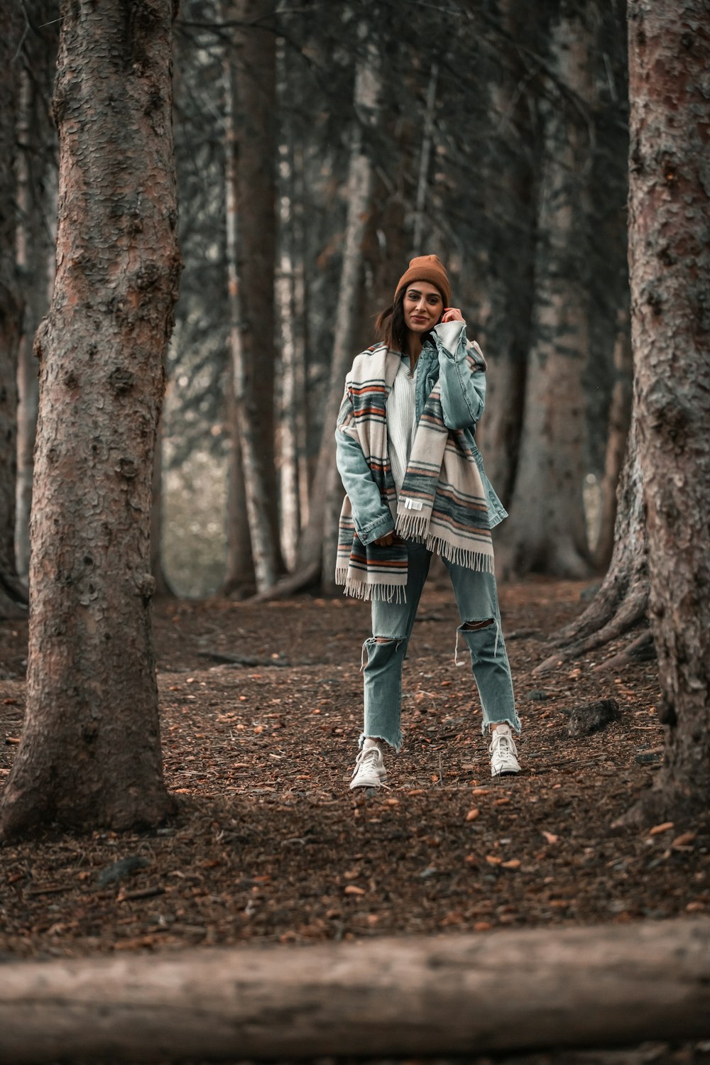 woman standing in forest