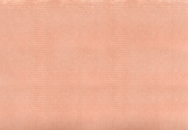 A grid pattern of peach-colored tiles creates a uniform surface, with each tile having a subtle glossy finish that reflects light.