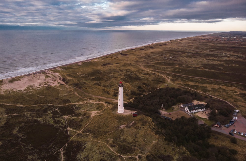 lighthouse on shore during daytime