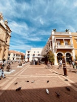 A historic colonial town square with charming architecture and lively atmosphere.