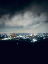 A glowing network of cloud servers interconnected against a twilight city skyline.