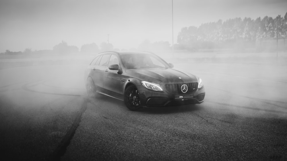 grayscale photography of Mercedes-Benz vehicle