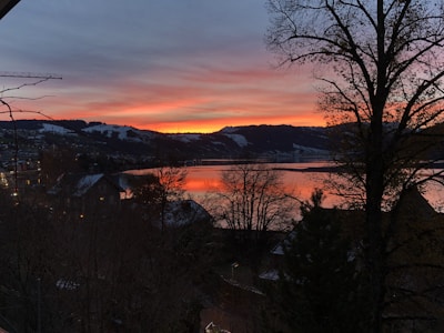 A scenic photo capturing a beautiful sunset over the lake.