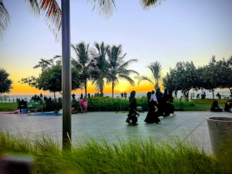 Sunset gathering of KingdomPath members sharing fellowship and prayer outdoors.