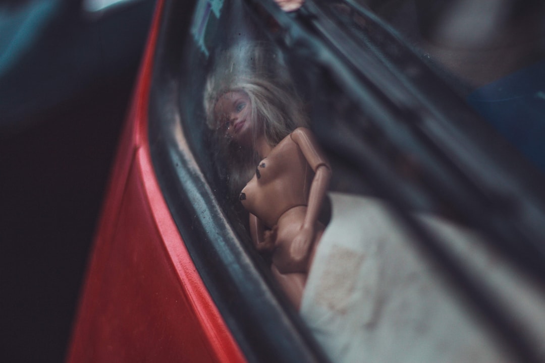 naked doll in vehicle