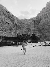 A group of tourists enjoying a guided tour at the famous Shipwreck Beach.