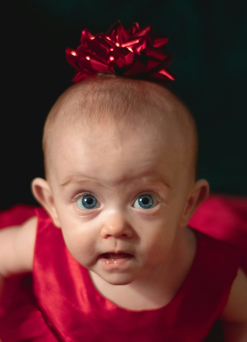 selective focus photography of girl wearing red dress looking up