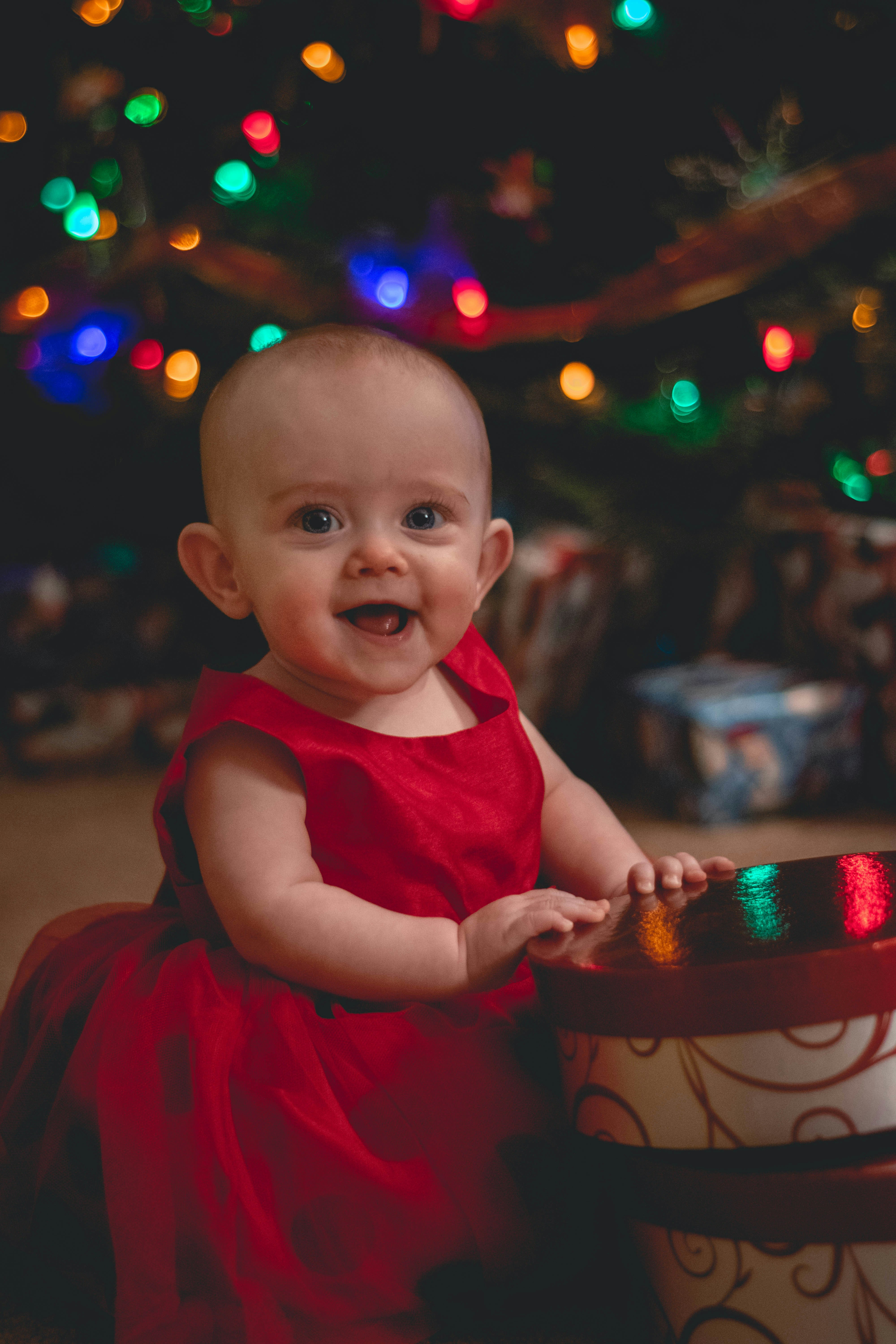 Selective focus photography of smiling girl beside container photo ...