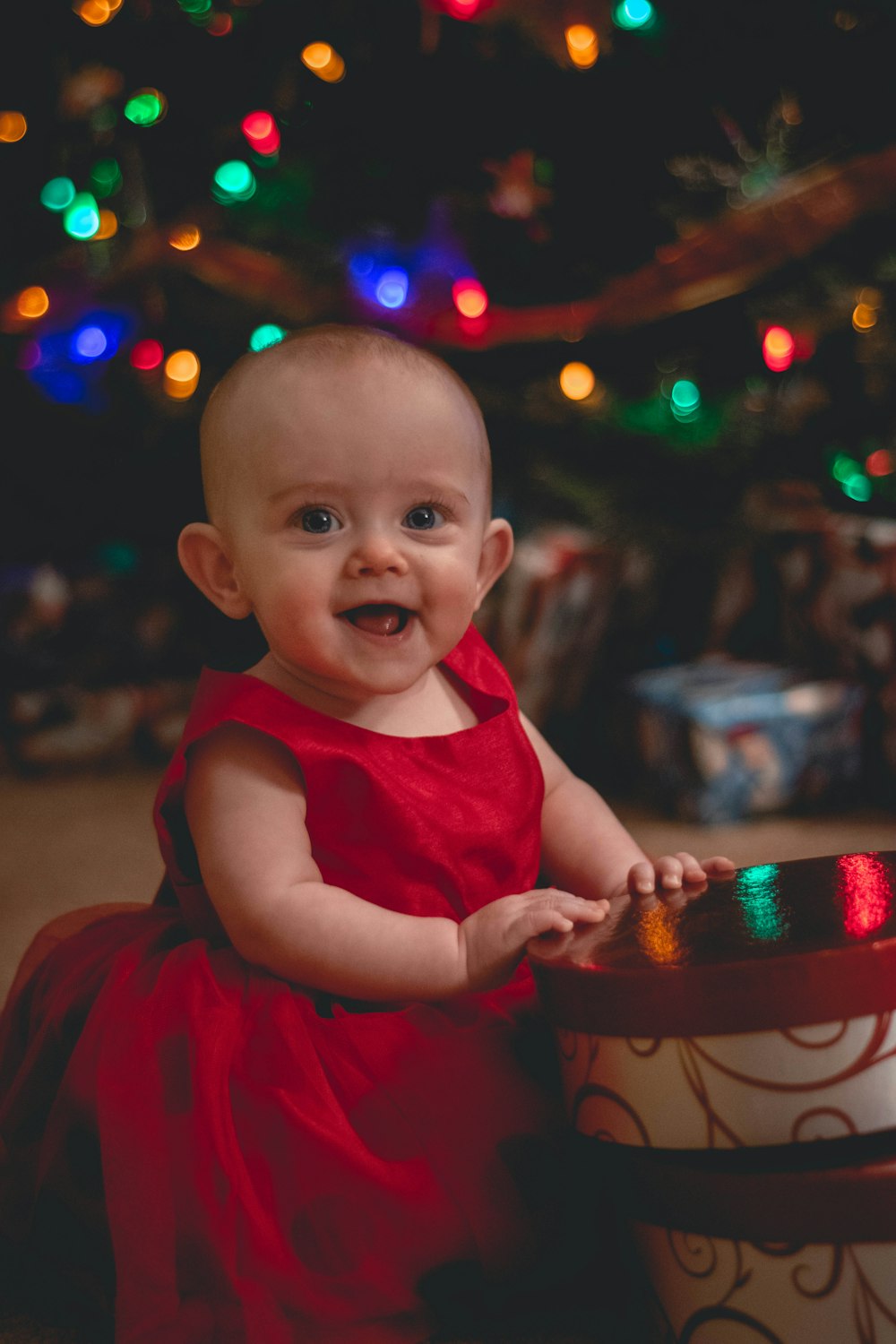 selective focus photography of smiling girl beside container