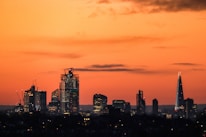 Austin city skyline at sunset with courthouse in the foreground.