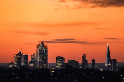 Austin city skyline at sunset with courthouse in the foreground.