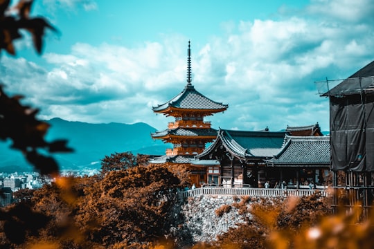 people near pagoda under white and blue sky in Kiyomizu-dera Japan