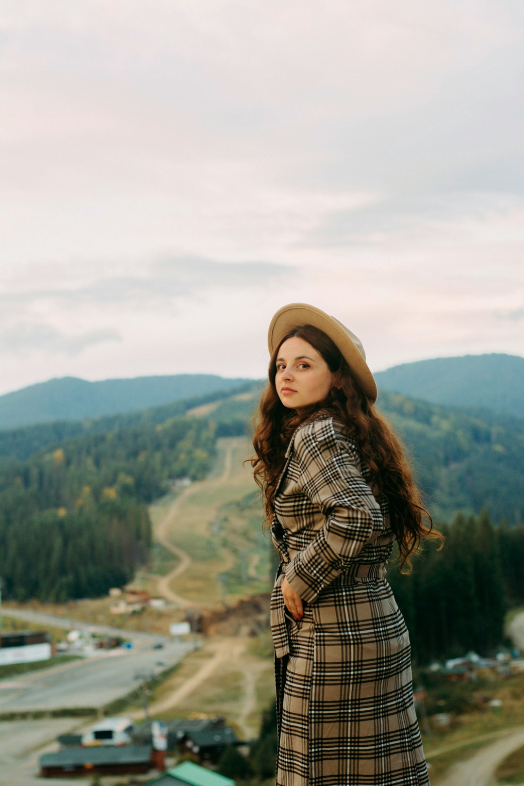 selective focus photography of woman in plaid coat