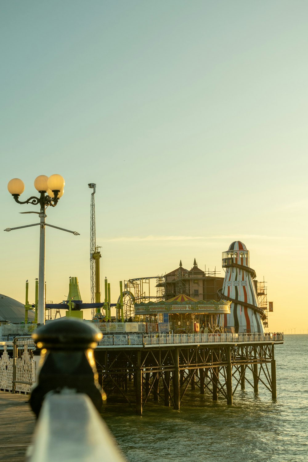 selective focus photography of theme park on shore during daytime