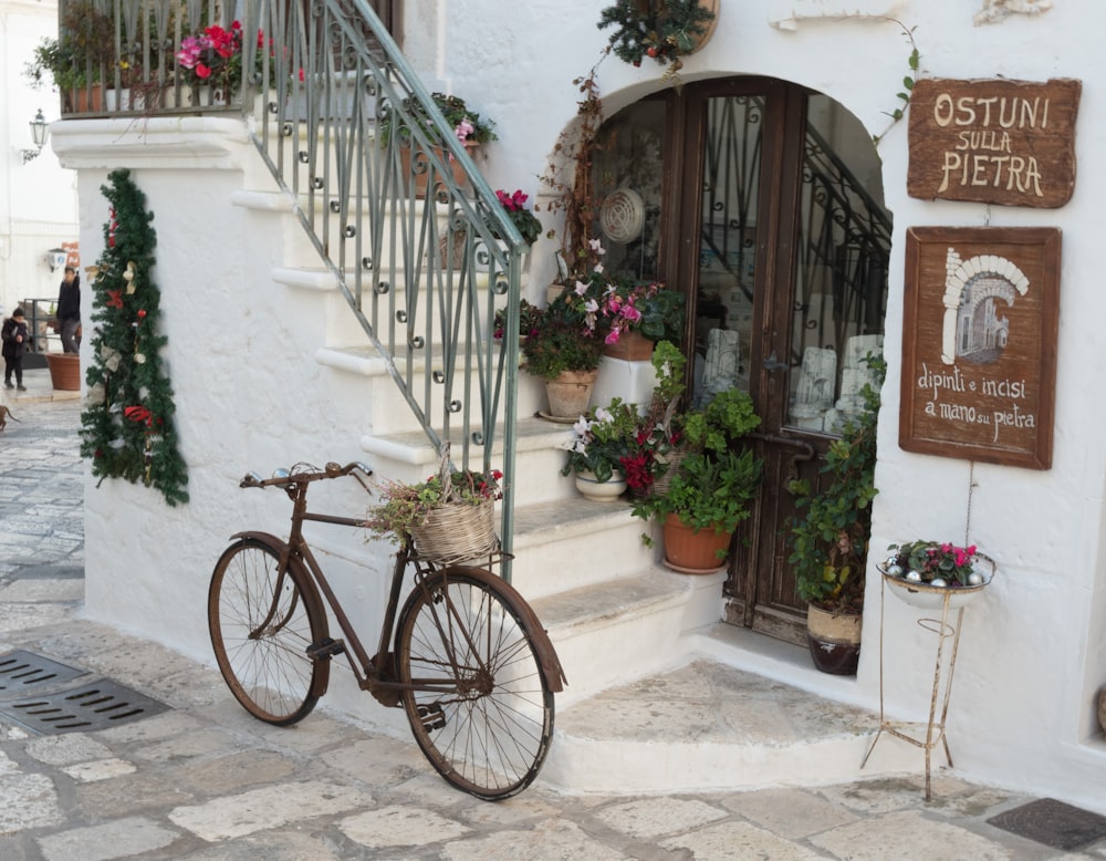 city bike with basket parked on stairs