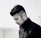 selective focus photography of man in zipped jacket with his head down