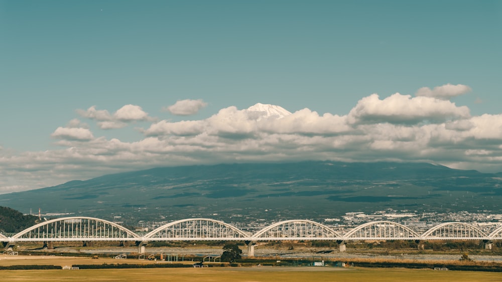 view of metal bridge near mountain at daytime