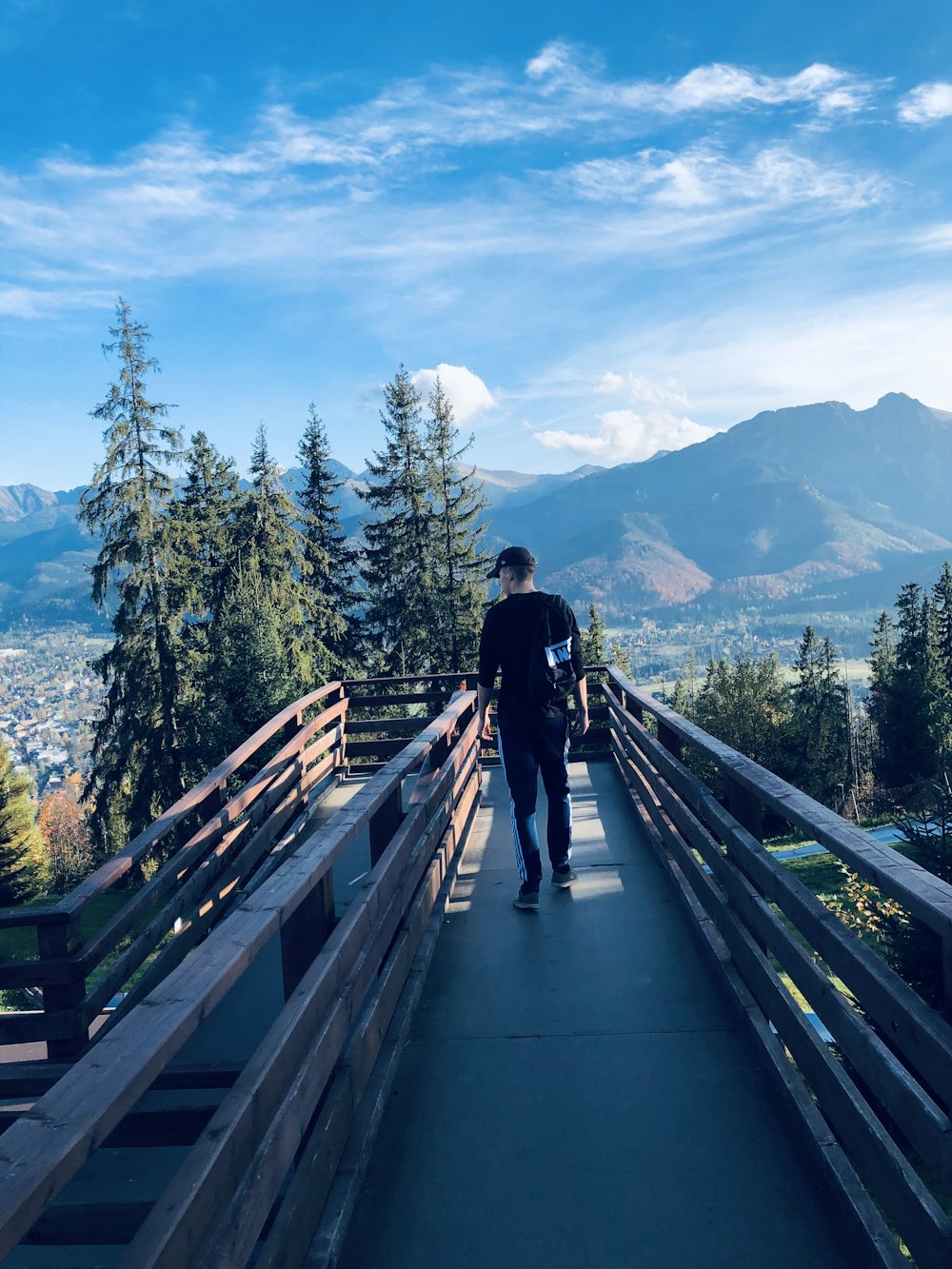 man standing on stairs during daytime