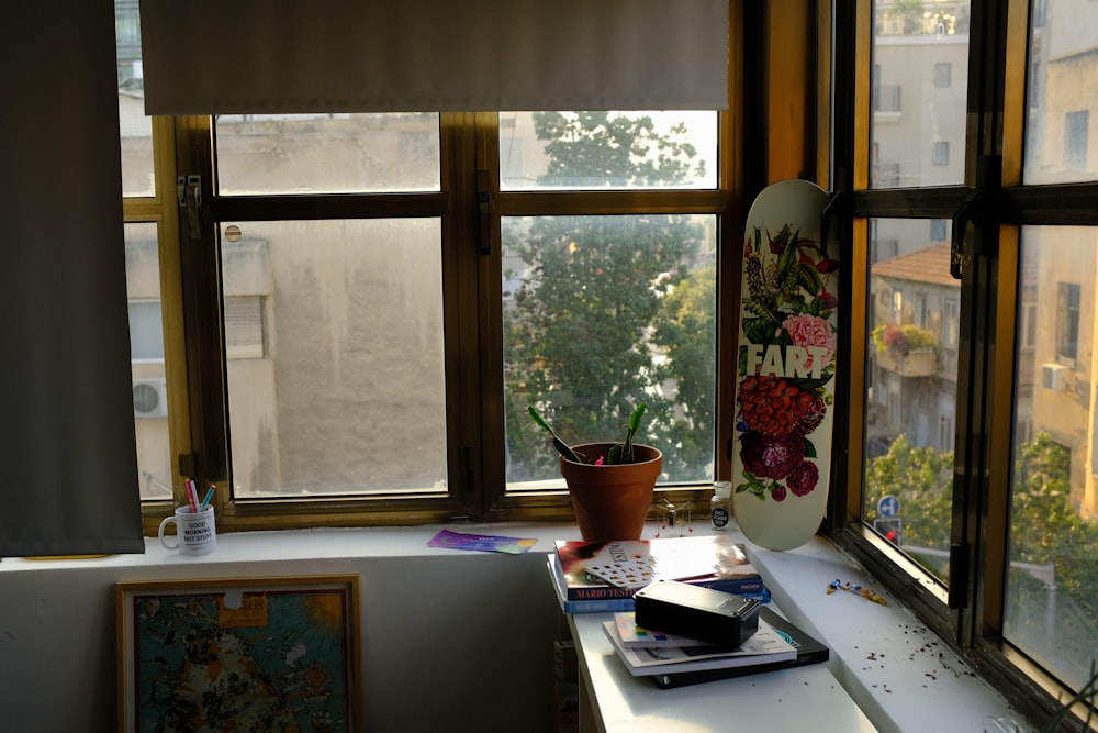 a window sill with a skateboard on top of it